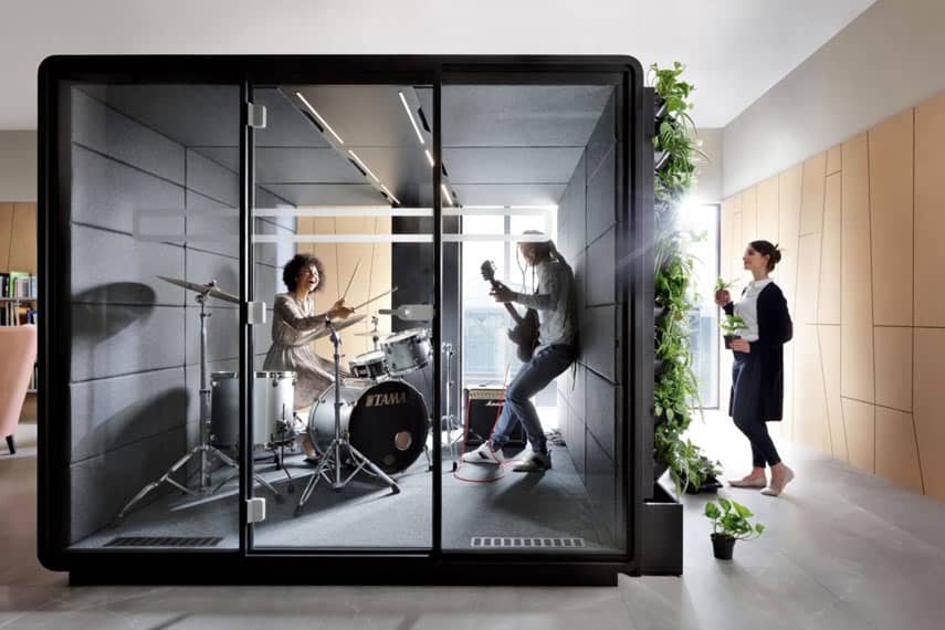 Office pod with band practicing inside